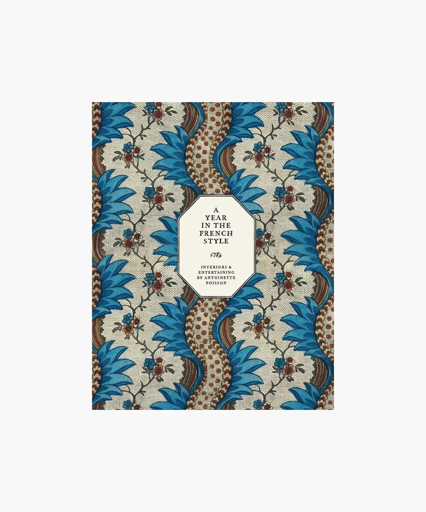 The cover of the book "A Year In The French Style" by Antoinette Poisson features a geometric pattern with vibrant blue and brown flowers and swirls.