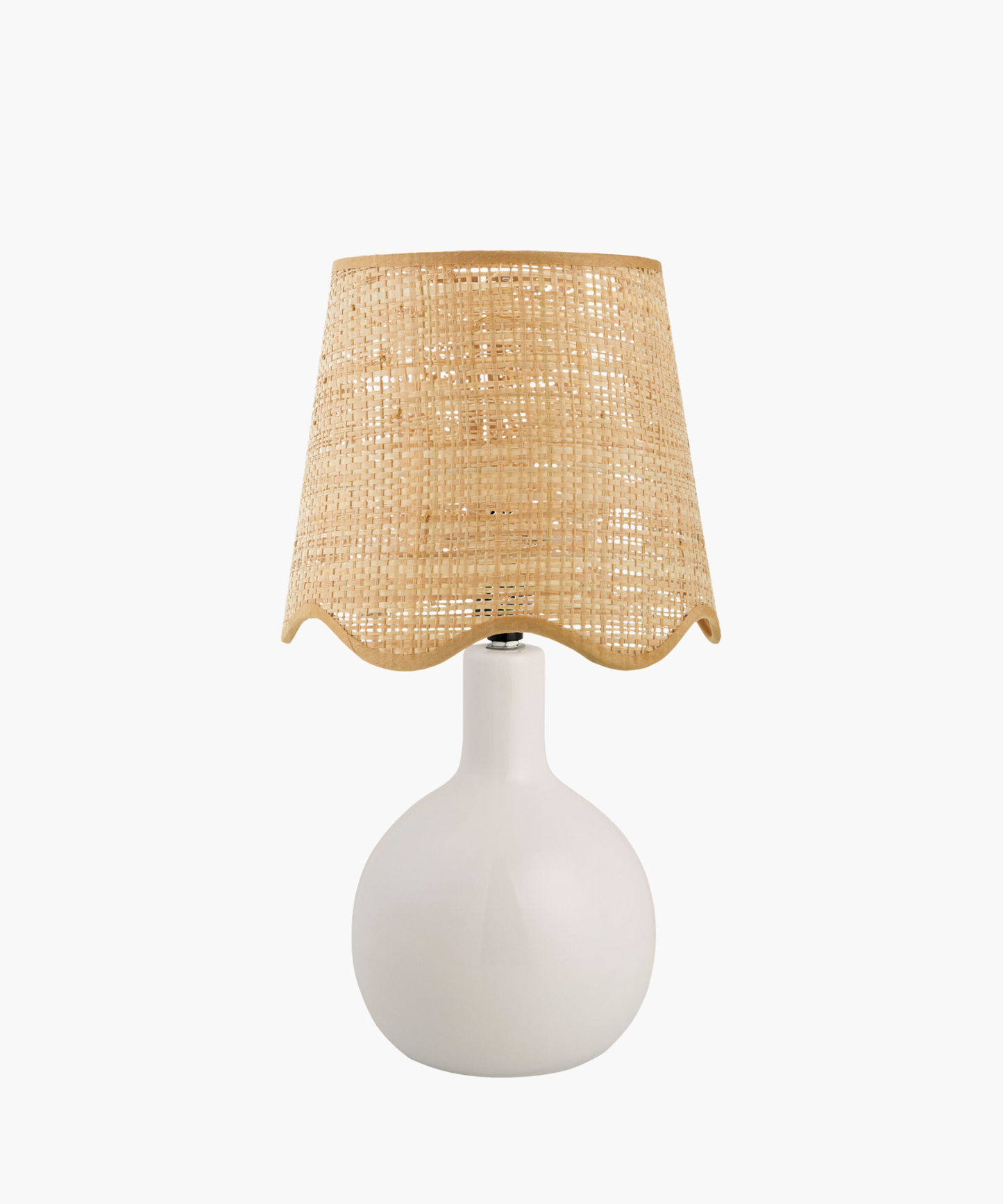 A modern table lamp with a sleek white ceramic base and a woven beige rattan shade. The design is minimalist, giving a cozy, natural feel.