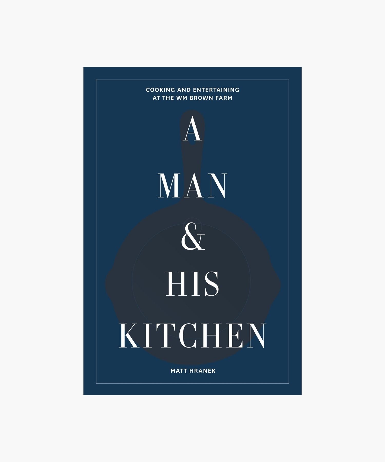 The cover of "A Man & His Kitchen" by Matt Hranek features a dark blue background with white text overlaying a silhouette of a skillet. The tone is elegant and inviting.