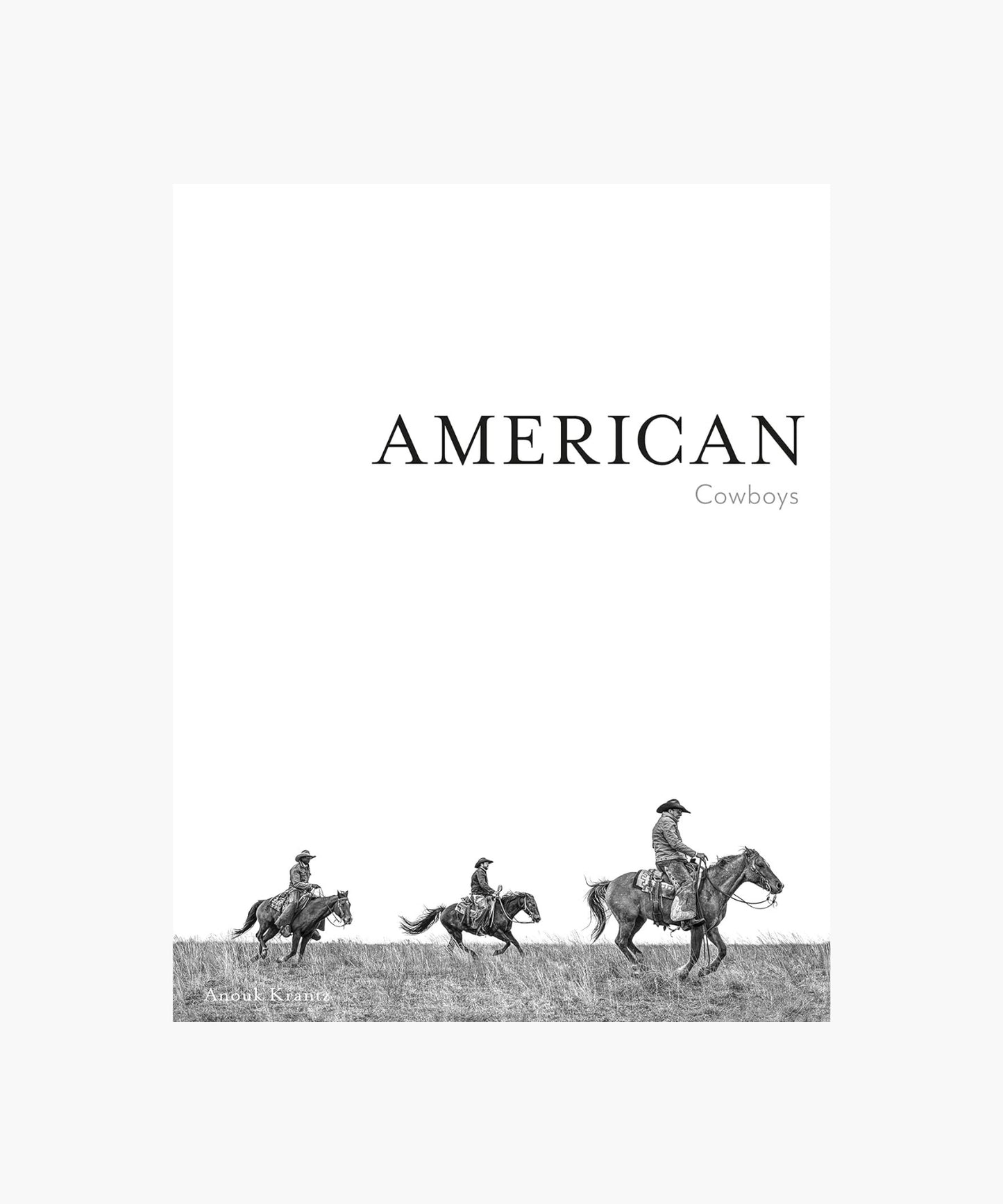 The cover of the book "American Cowboys" by Anouk Krantz features three cowboys on horseback, riding across a grassy field, conveying a sense of adventure and the American West.