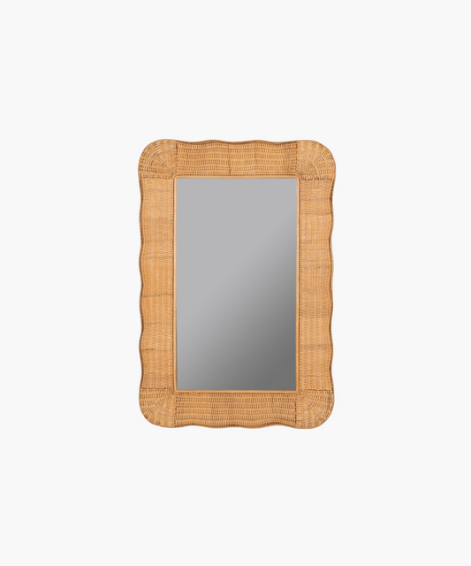 A rectangular mirror with a wavy, wicker-style frame in light brown. The design adds a rustic and natural touch, evoking a warm, cozy feel.