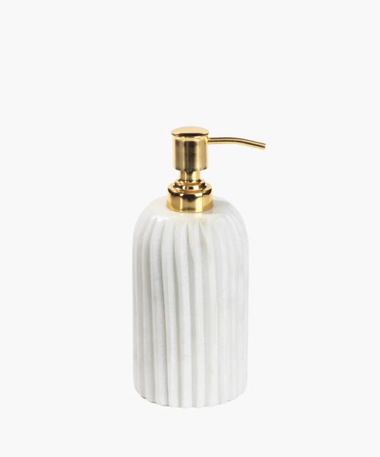 Elegant soap dispenser with a ribbed white marble base and a shiny gold pump. The design conveys luxury and sophistication in a minimalistic style.