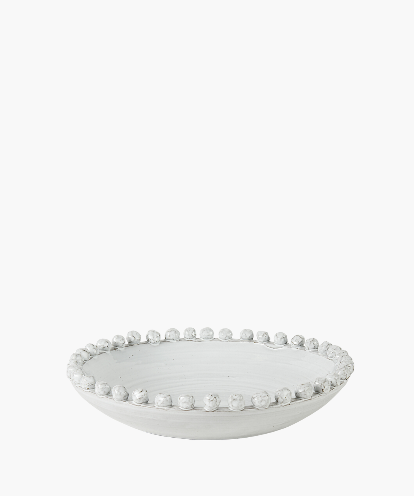 A white ceramic bowl with a smooth finish and decorative round beads along the rim. The bowl is shallow, with an elegant, minimalist design.