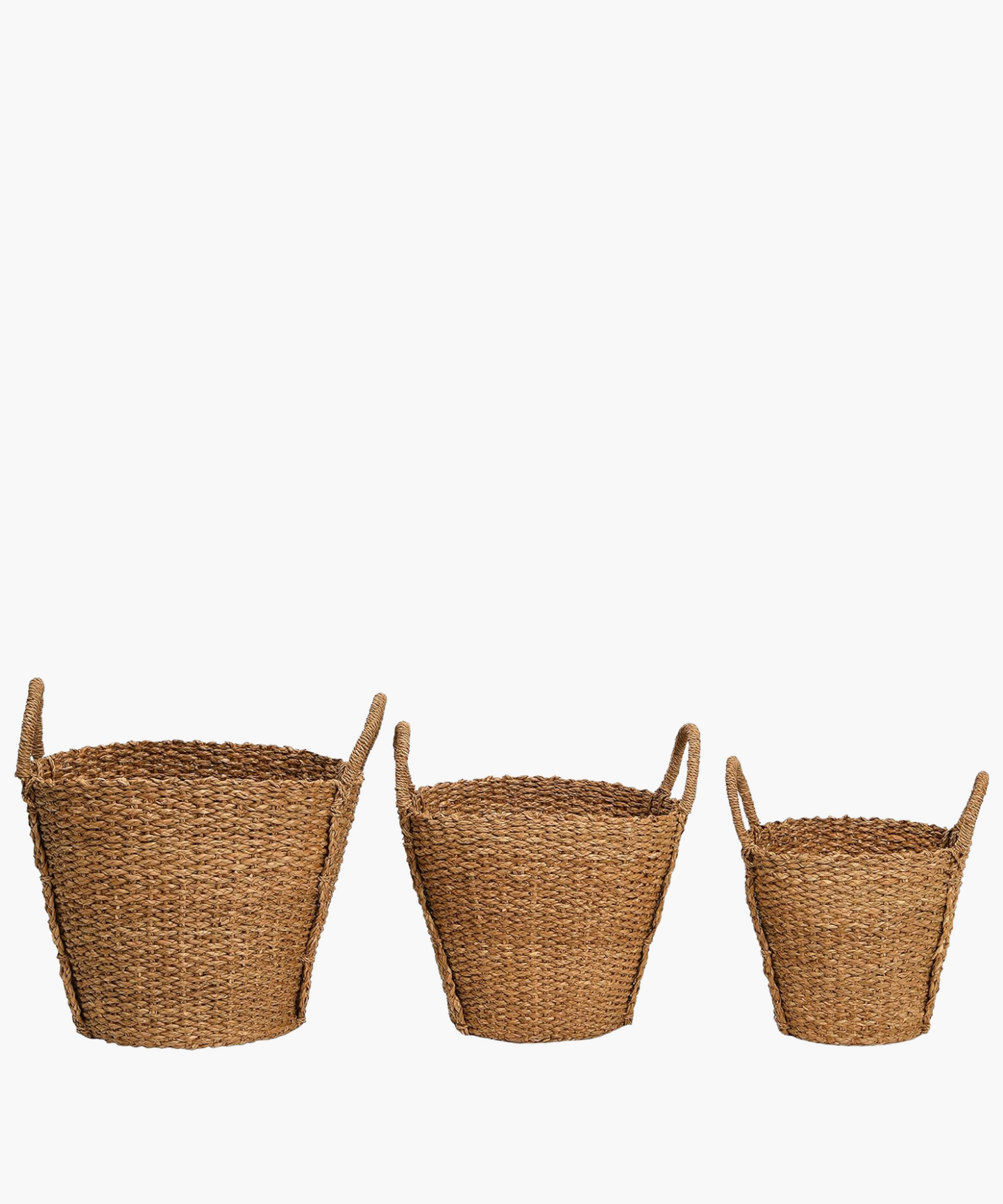 Three hand-woven baskets in various sizes each with two sturdy looped handles. The basket's braided texture conveys a rustic and natural feel, perfect for storage or decoration.