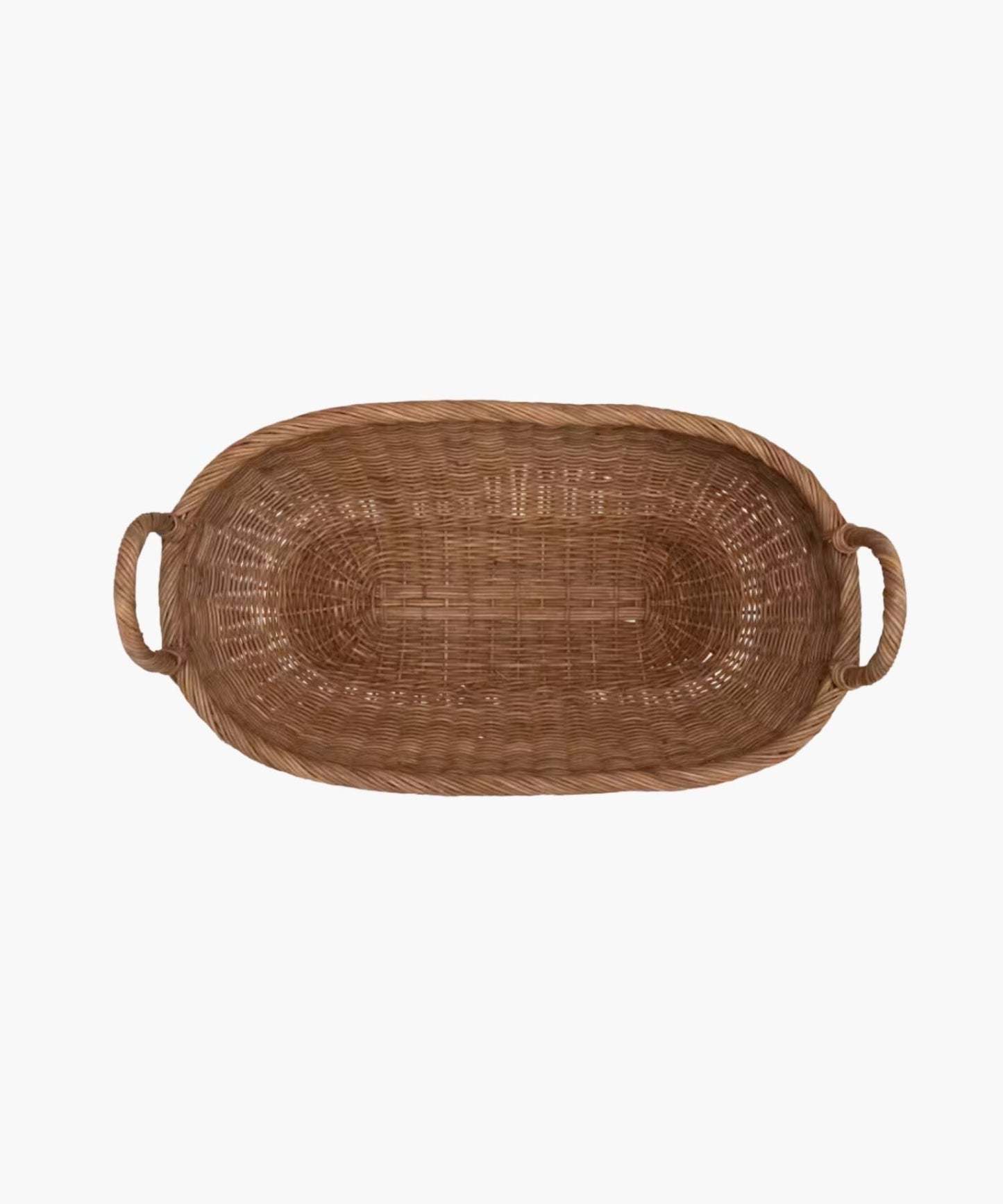 Overhead view of a handwoven wicker basket with two looped handles on either side featuring an organic oval shape and a natural brown finish. The basket has a natural, rustic appearance.