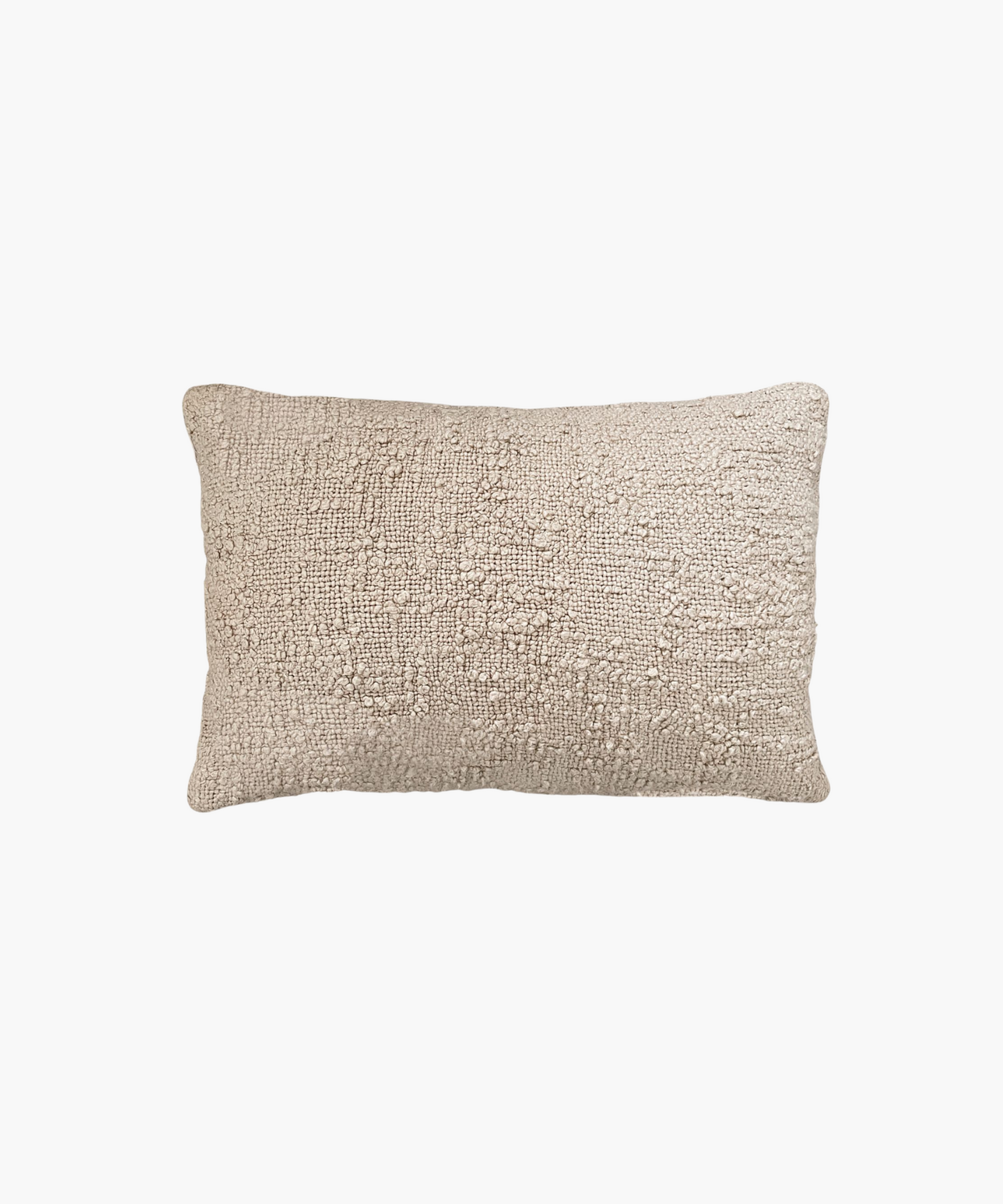 A rectangular lumbar beige pillow with a textured, woven surface. The pillow appears soft and cozy, evoking a sense of warmth and comfort.