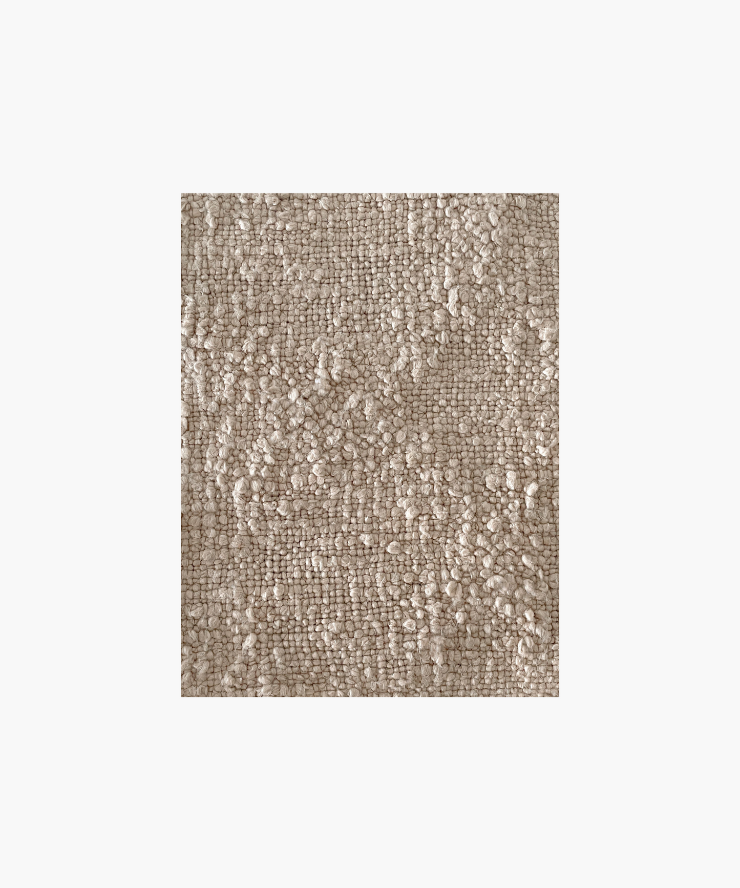 A detailed picture of a beige pillow highlighting the textured, woven surface. The pillow appears soft and cozy, evoking a sense of warmth and comfort.