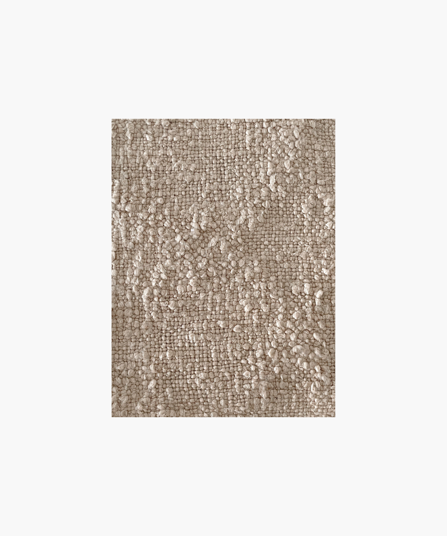 A beige colored woven throw blanket highlighting the textured pattern and color conveying a cozy and inviting feel. 