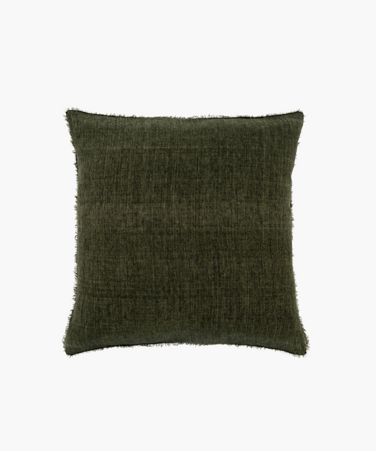 A dark olive green pillow with a textured fabric and subtle fringe along the edges, creating a cozy and elegant feel. It exudes a sense of warmth.