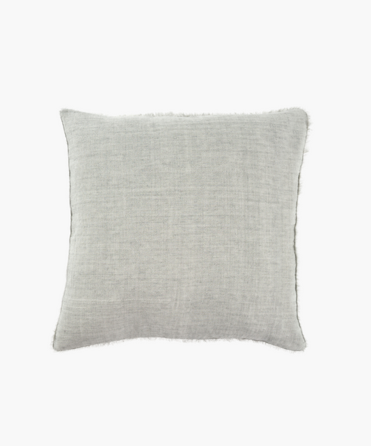 A light gray, square linen pillow with a soft, textured fabric and subtle frayed edges on a white background, conveying a minimalist and cozy feel.