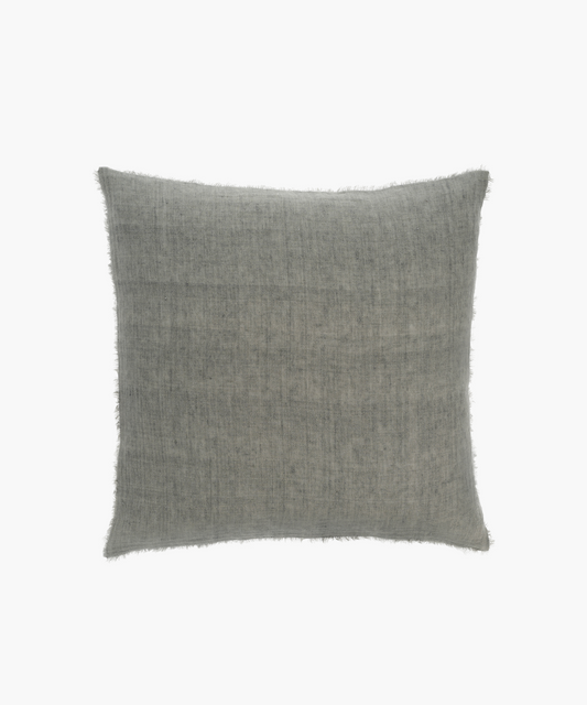 A square, light gray pillow with a textured fabric and fringed edges. The design exudes a soft, cozy, and understated elegance.