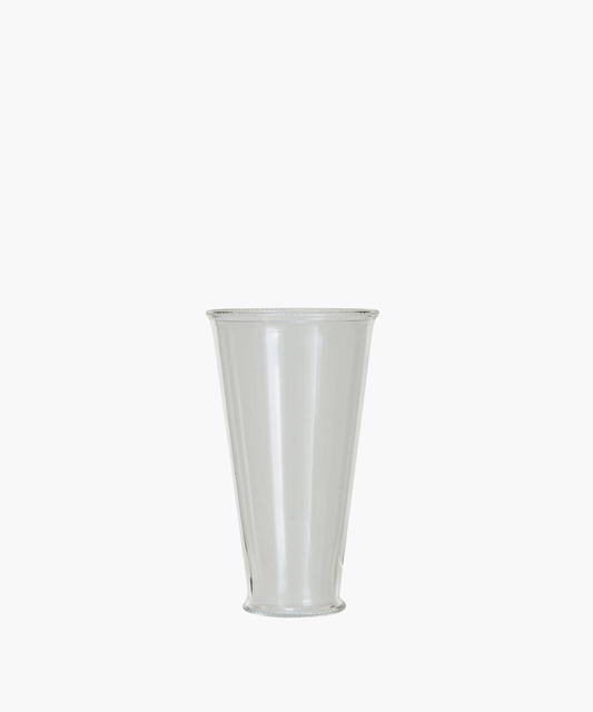 A clear, cylindrical drinking glass with a slightly flared rim. The simple design and transparent material create an elegant and minimalist appearance.