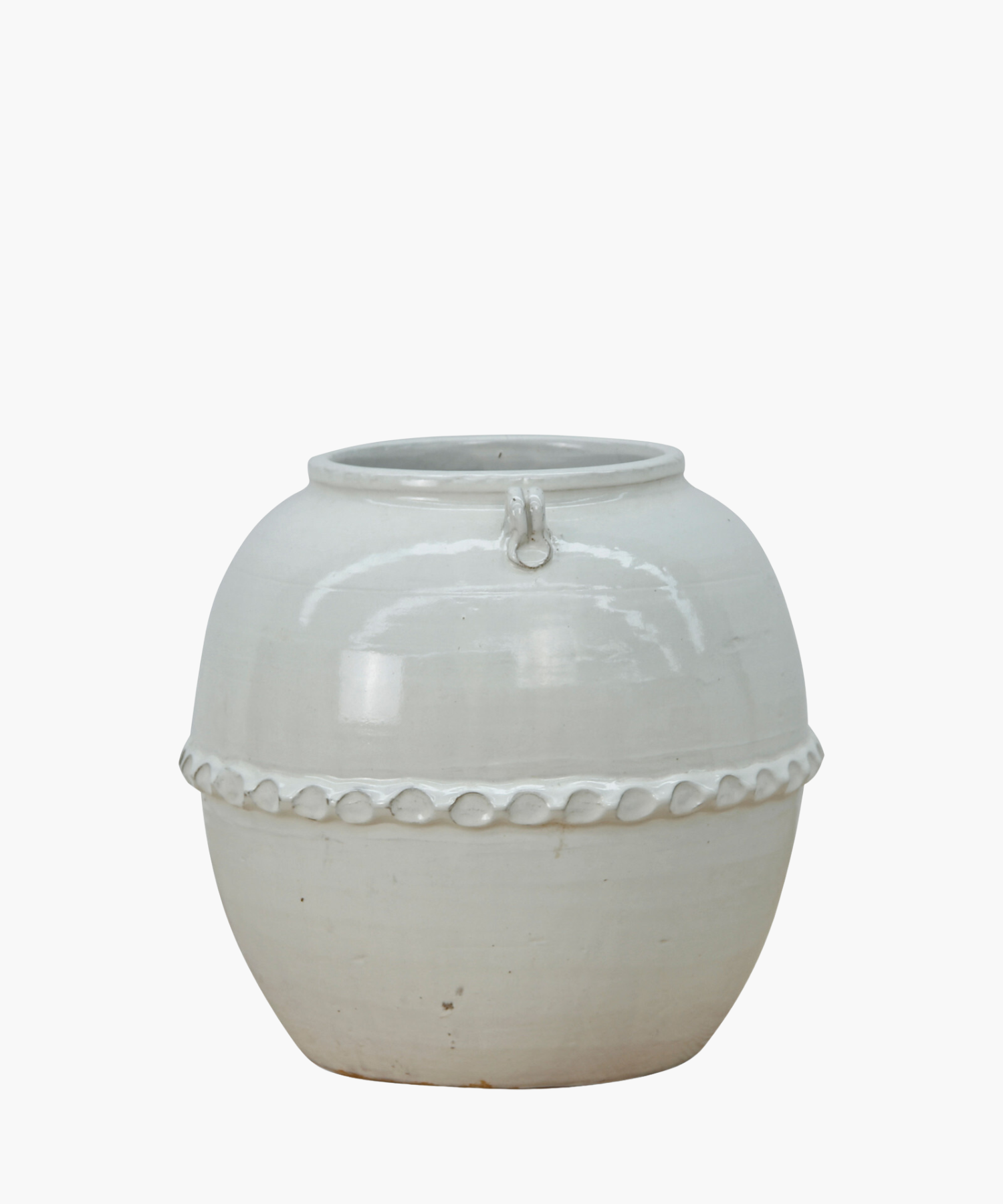 A white ceramic pot with a glossy surface and rounded shape. It features a decorative band with a loop design near the top, giving an elegant look.