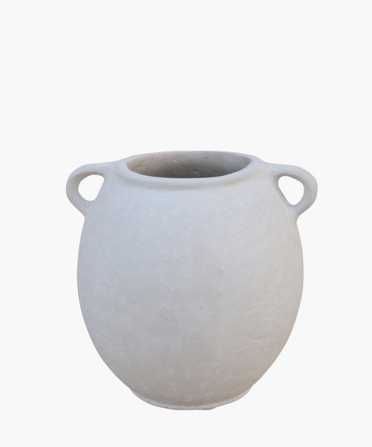 A simple, round, off-white clay vase with two small handles on each side. The smooth surface and muted tone convey an elegant, minimalist aesthetic.