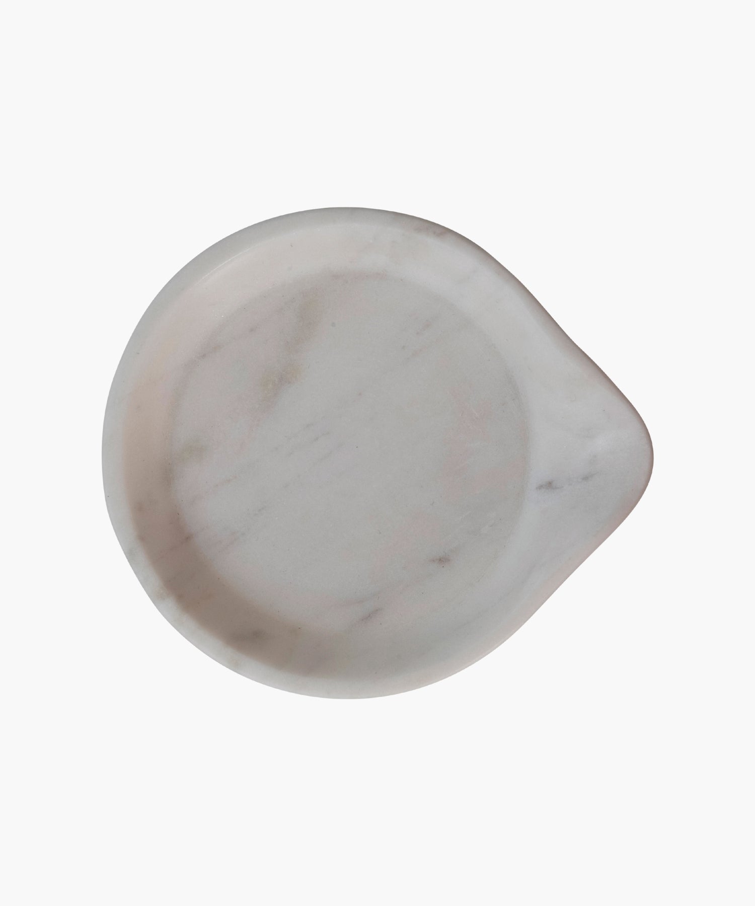 Overhead view of a smooth, round white marble dish or spoon rest. Its minimalist design and soft curves create an elegant, serene appearance.