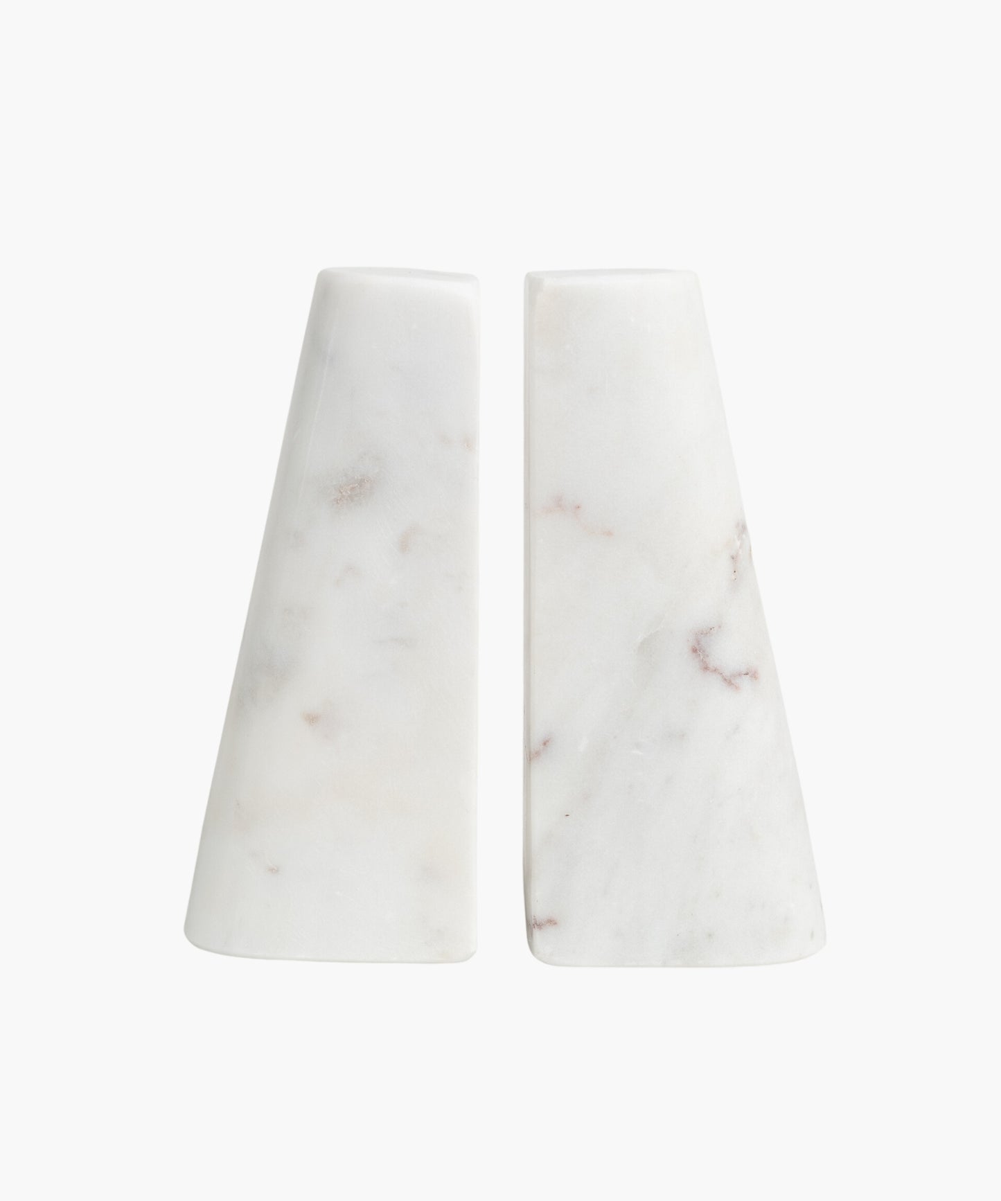 Two white marble bookends with a smooth, conical shape, each featuring subtle brown and gray veining. They appear minimalist and elegant.