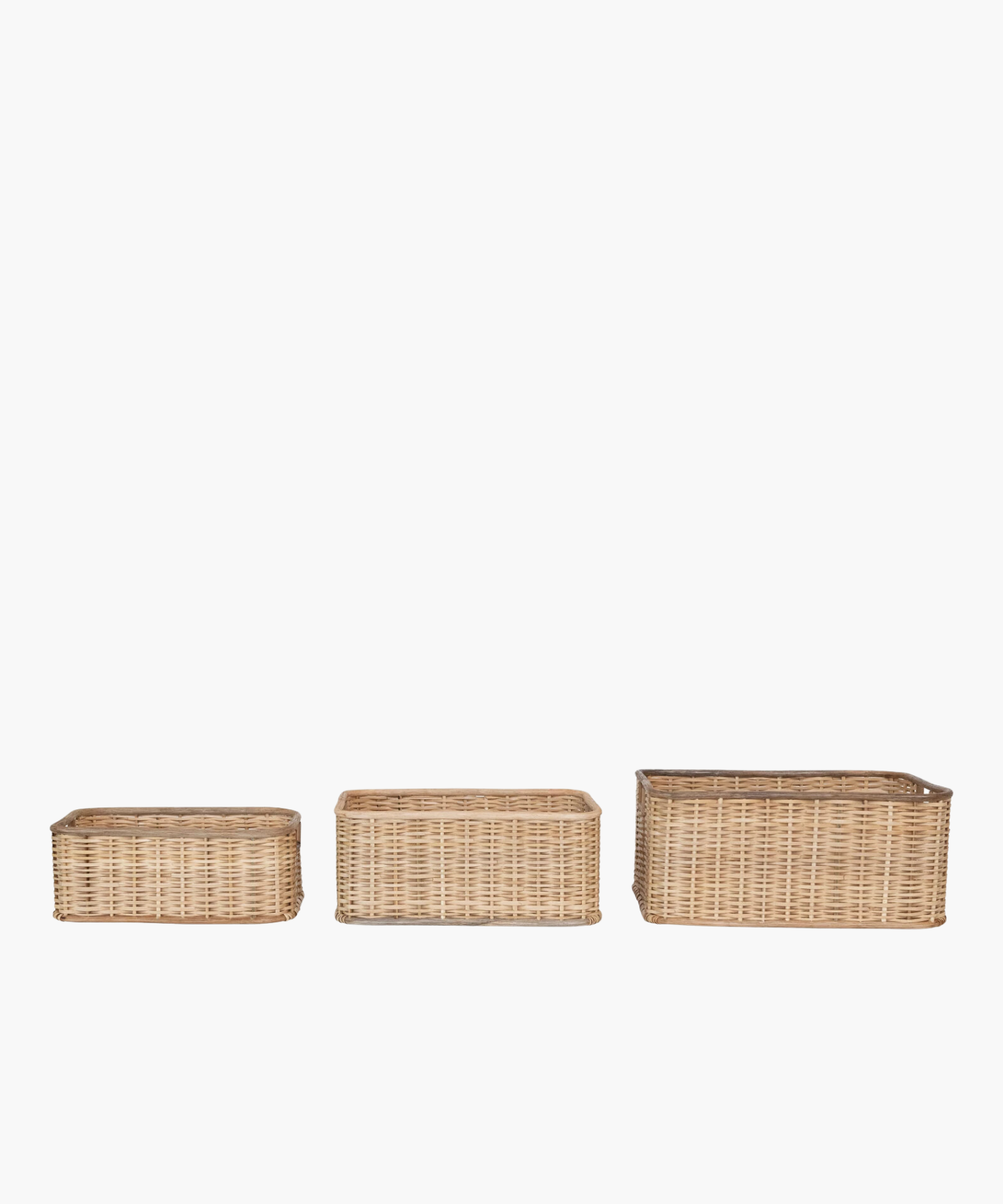 Three square wicker baskets in various sizes with natural woven texture, two square cut-out handles. The earthy tone conveys a rustic, homely, and practical feel.