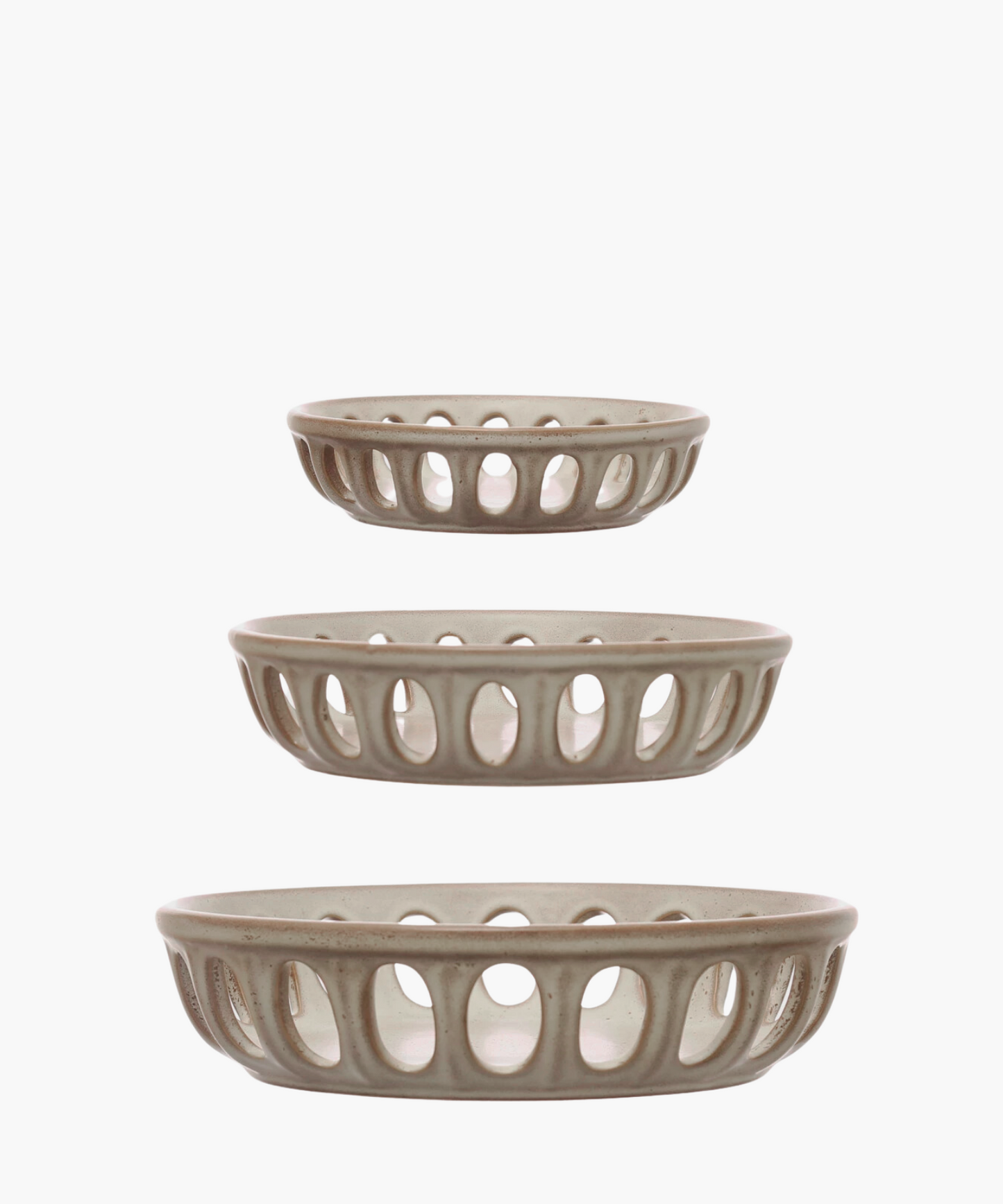 Three beige ceramic basket bowls with open oval patterns are arranged vertically. Each basket is slightly larger than the one above it, creating a harmonious tiered effect.