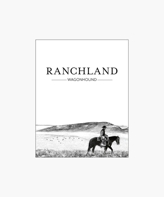 The cover of the book "Ranchland: Wagonhounse" featuring a black-and-white image of a cowboy riding a horse across an expansive, open ranch landscape.