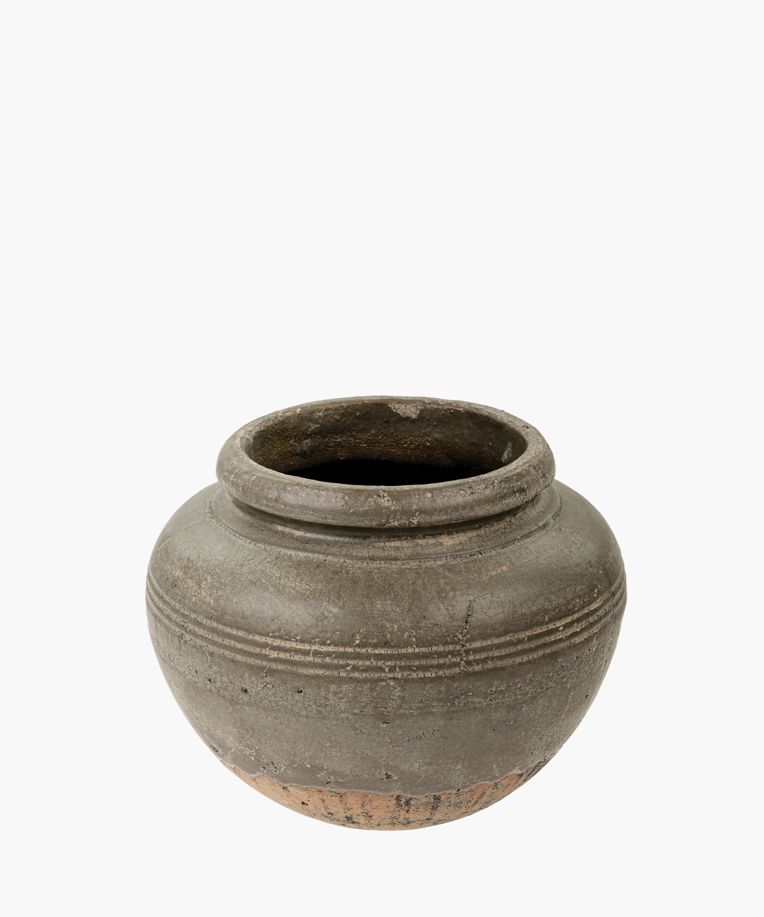 A round, weathered clay vase with a wide opening and decorative horizontal ridges. The vase conveys an earthy, rustic, and historical feel.