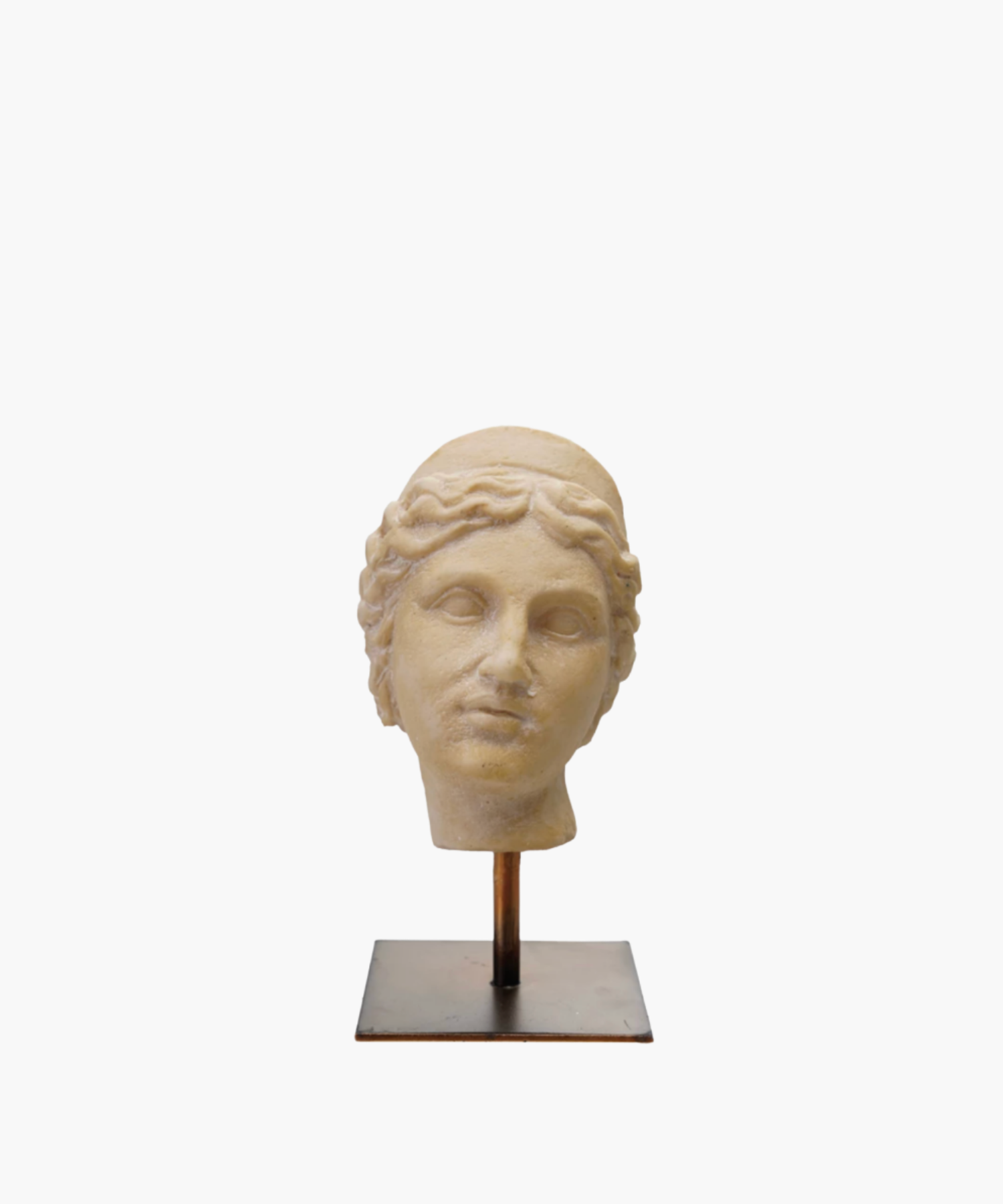 Bust of an ancient statue on a stand, depicting a serene face with wavy hair. The worn texture conveys antiquity and classical elegance.