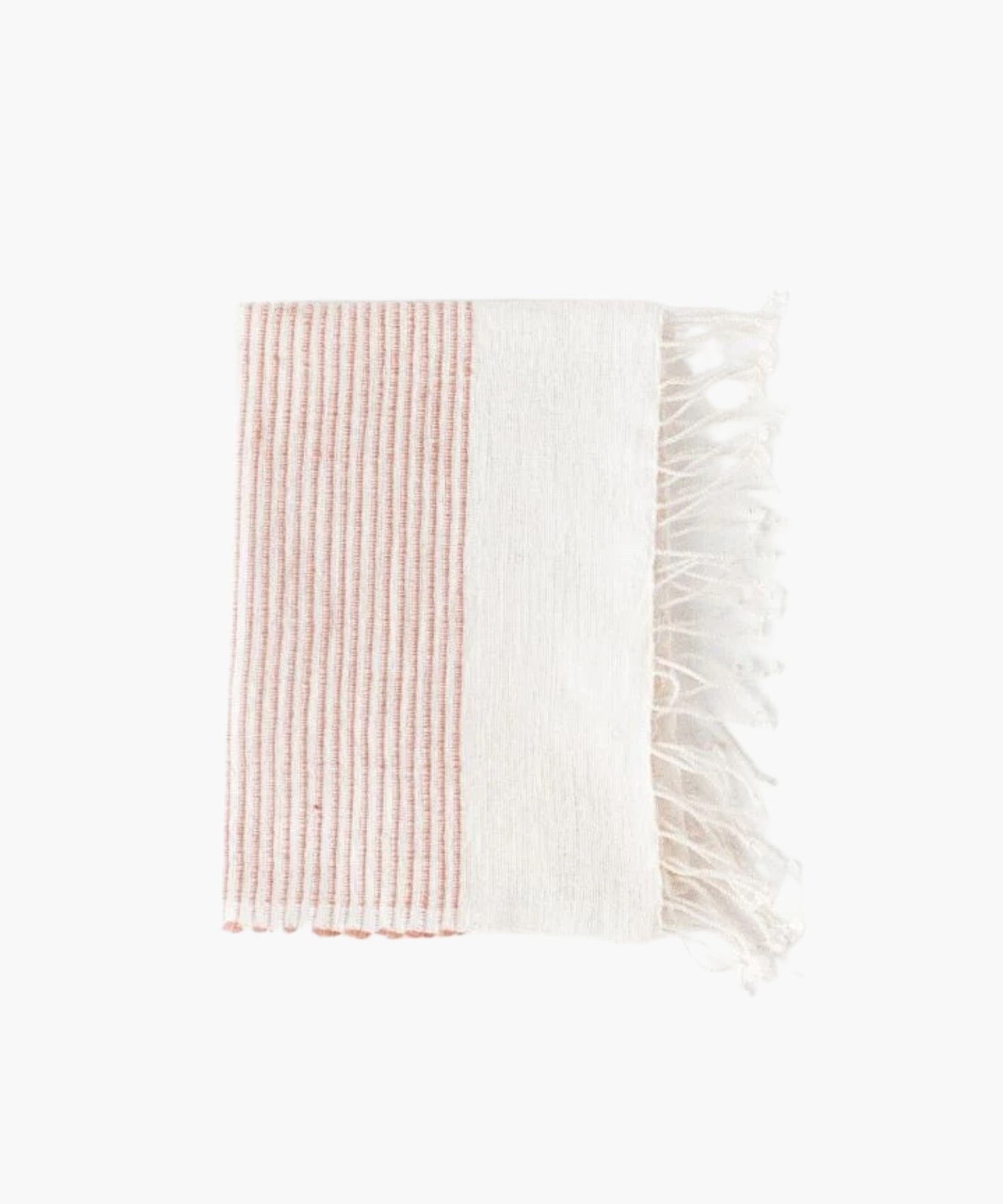 A folded hand-woven cotton hand towel with vertical blush stripes on the left half and plain white on the right. The towel's fringe is visible on the right side.