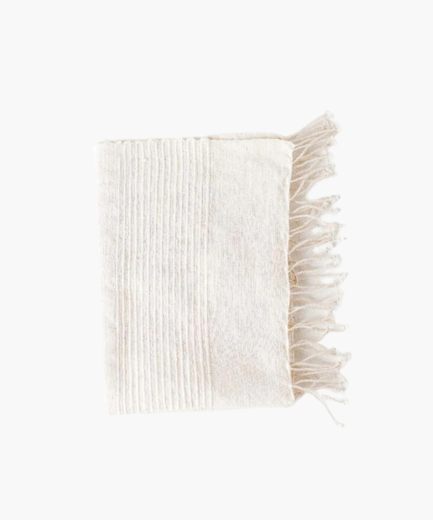 A folded hand-woven cotton hand towel with vertical natural stripes on the left half and plain white on the right. The towel's fringe is visible on the right side.