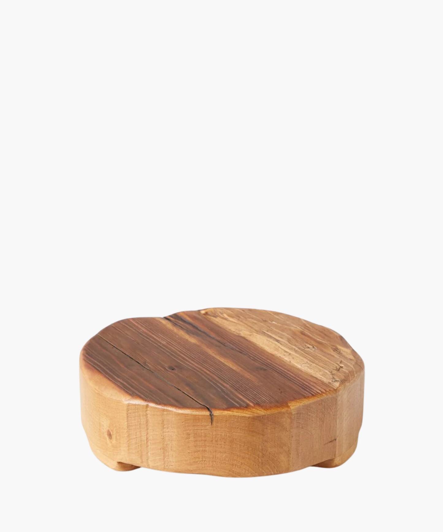 Round wooden pedestal or trivet made of smooth, natural wood with subtle grain patterns, supported by small rounded legs. Conveys rustic and minimalist elegance.