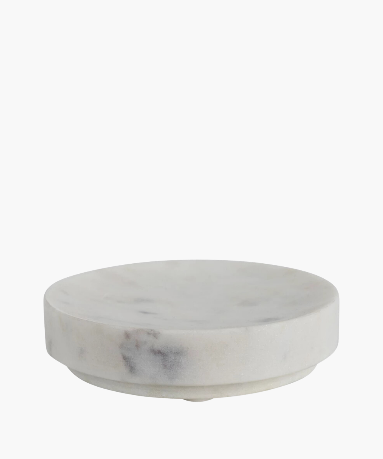 Round white marble soap dish with subtle gray veining. The smooth texture conveys simplicity and elegance.