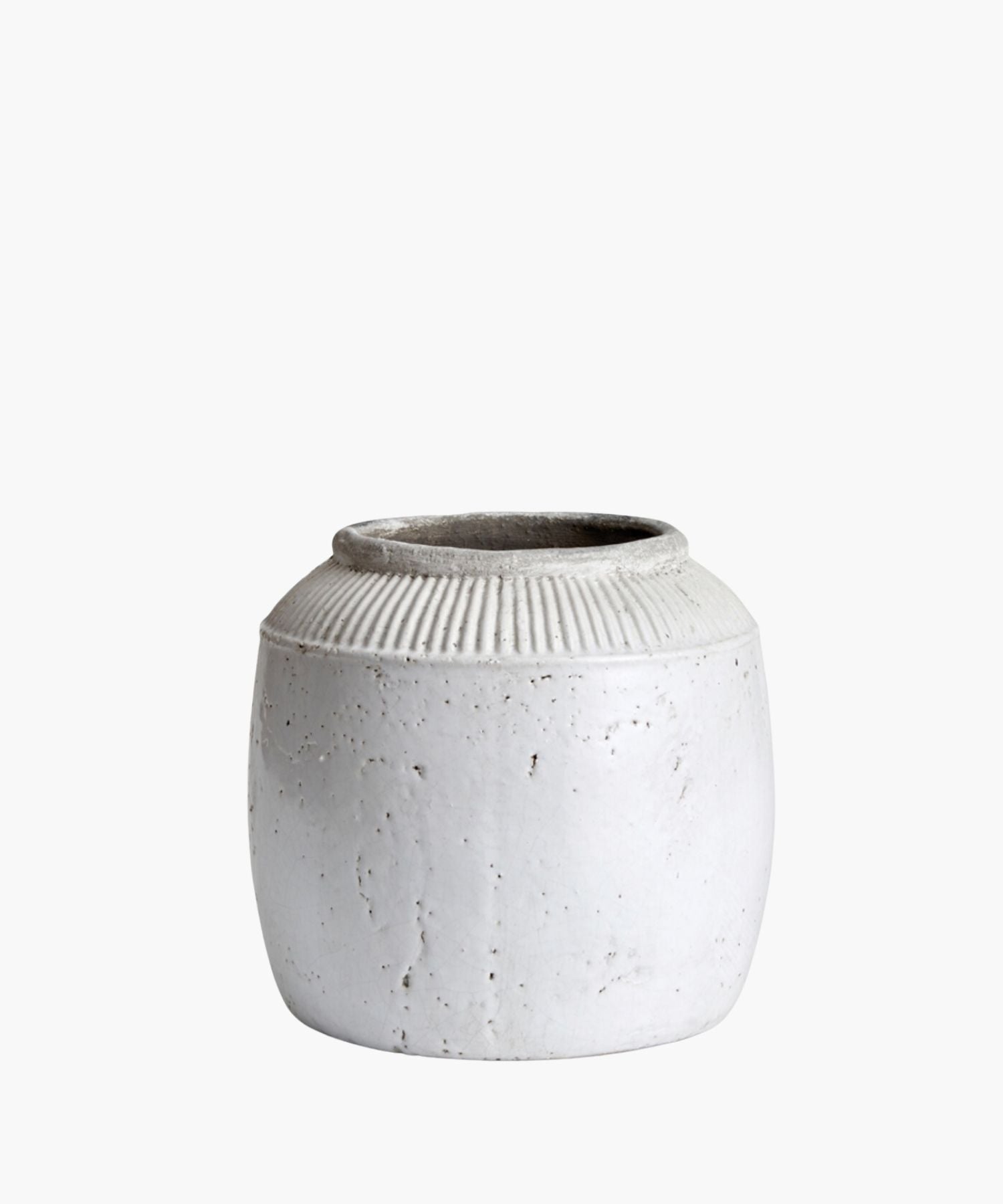 A small textured white ceramic pot with a round body and a narrow opening. The pot has subtle vertical ridges near the top.