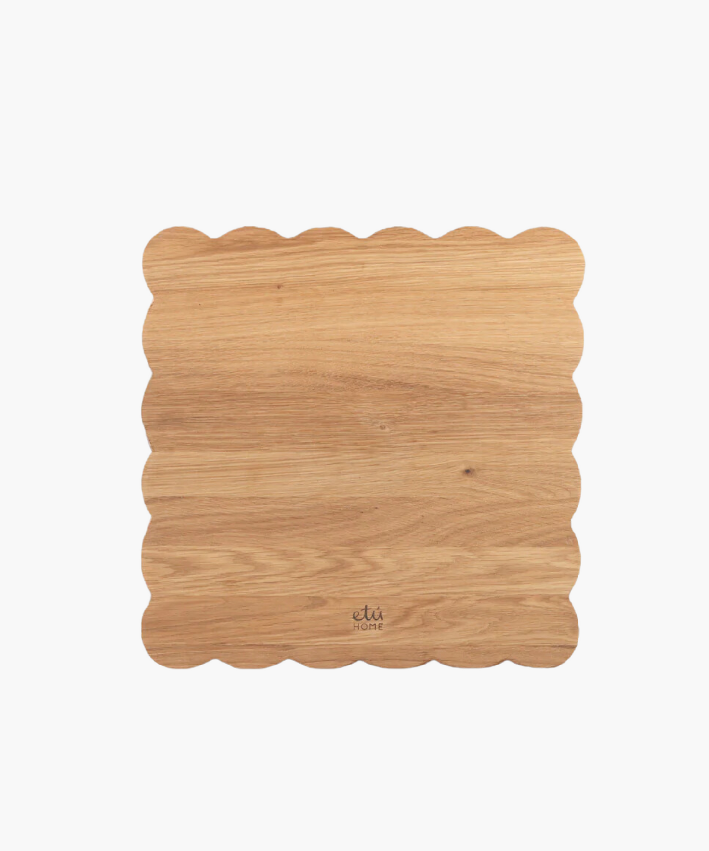 Scalloped-edge wooden cutting board with a light oak finish.