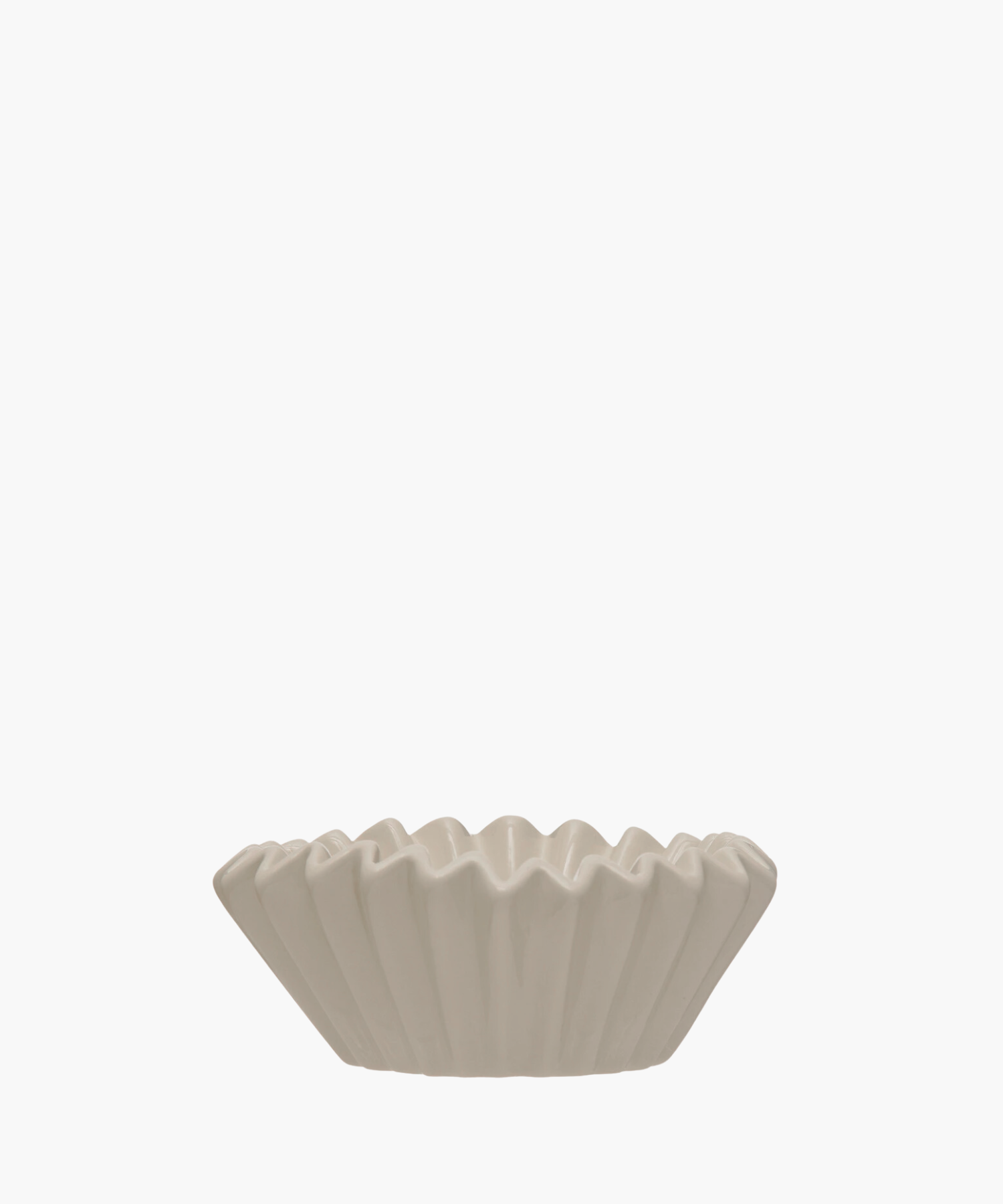 A white, fluted ceramic bowl. Its pleated edges are evenly spaced, creating a simple, utilitarian feel.