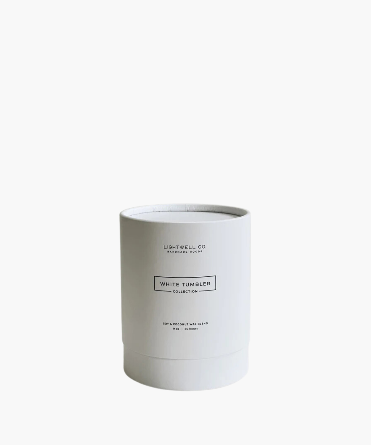 A white candle in its white cardboard box with a minimalist label reading "White Tumbler Collection." The design conveys a clean, calming aesthetic.