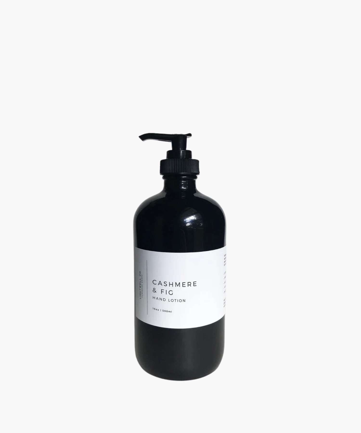 Black pump bottle of hand lotion labeled "Cashmere & Fig" against a white background. The design is minimalist, conveying elegance and luxury.