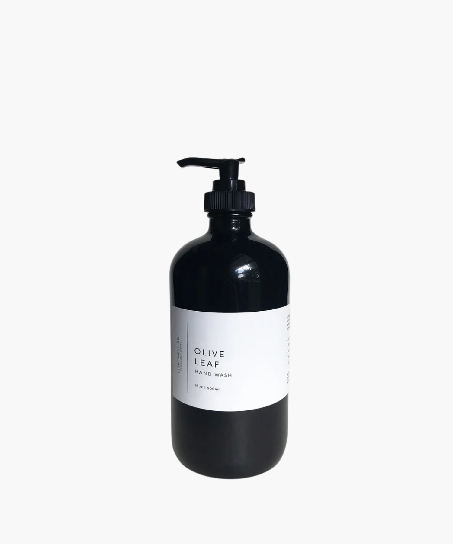 A sleek black bottle with a pump dispenser labeled "Olive Leaf Hand Wash." The minimalist design conveys a modern and elegant tone.