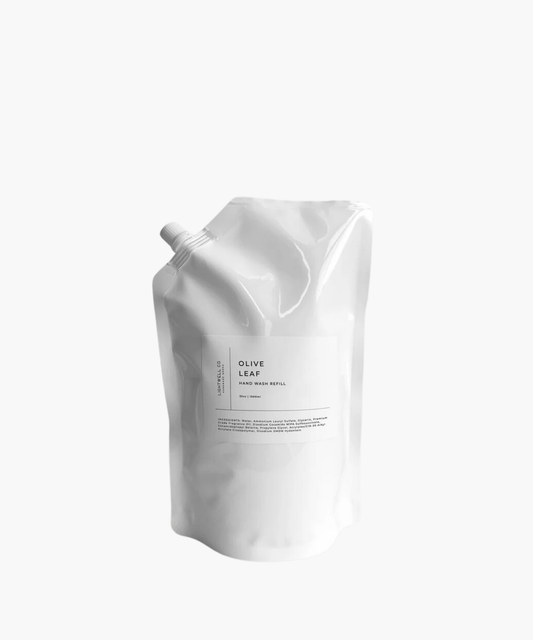 A sleek, white refill pouch labeled "Olive Leaf Hand Wash Refill" with a spout, minimalistic design, and modern typography, conveying a clean, eco-friendly aesthetic.