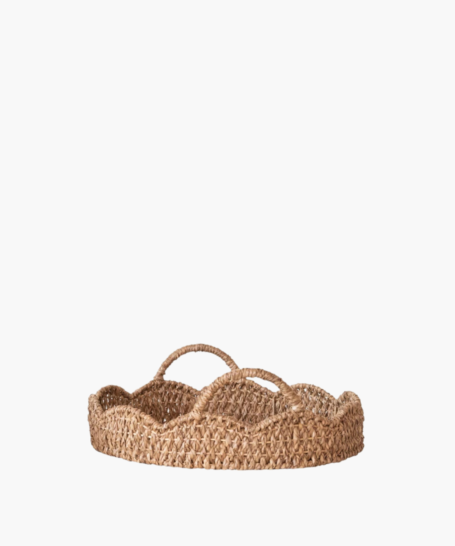 A woven, round basket with a scalloped edge and two looped handles. Made of natural fibers, it evokes a rustic and earthy aesthetic.